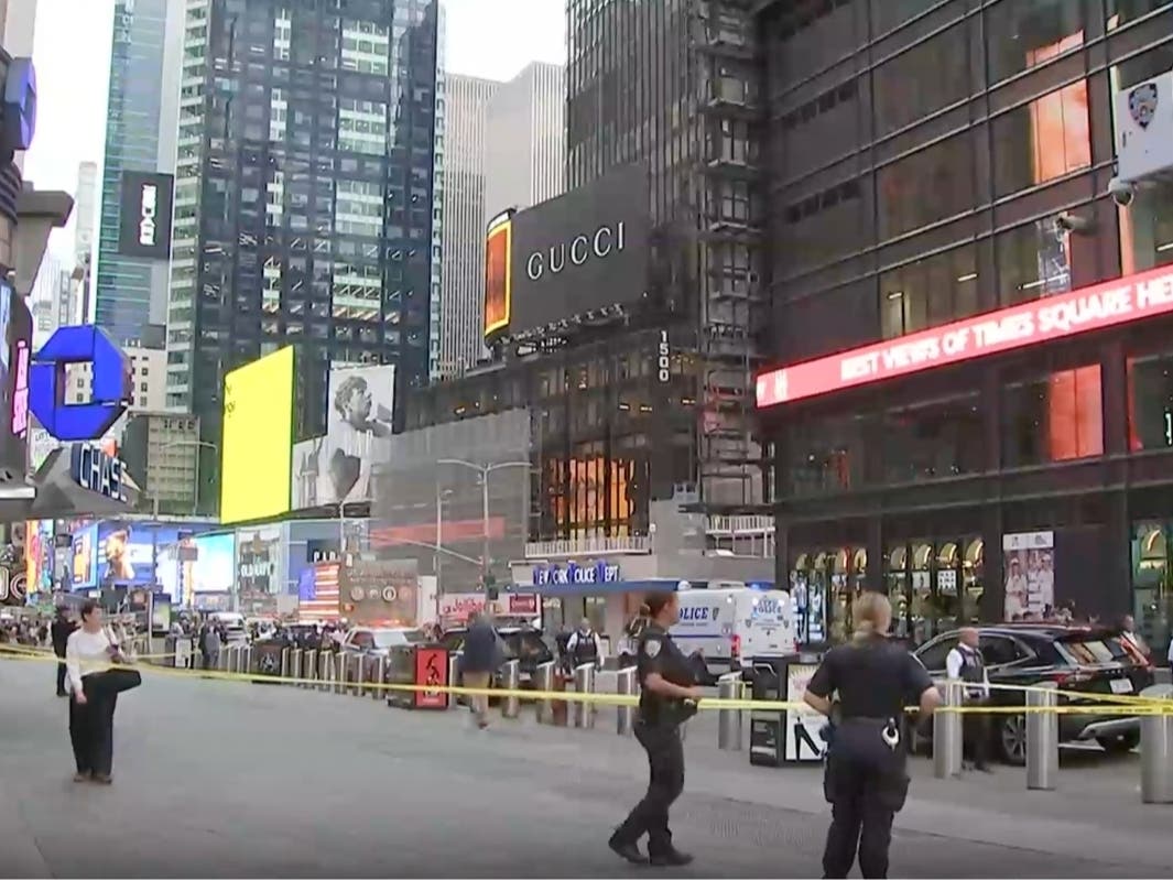NYPD officers on the scene after a woman brandishing two large knives was shot by officers in Times Square in New York, Monday, Aug. 31, 2026.