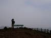 A man looks toward smoke from wildfires and fog obscuring the view from Grand View Park in San Francisco.
