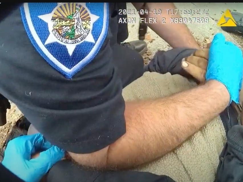 In this image taken from Alameda Police Department body camera video, officers pin 26-year-old Mario Gonzalez to the ground during an arrest, April 19, 2021, in Alameda. Gonzalez stopped breathing during the arrest and was pronounced dead at a hospital. 