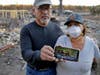 Justo and Bernadette Laos show a photo of the home they rented that was destroyed by the Kincade Fire near Geyserville, Calif., Thursday, Oct. 31, 2019. The fire started last week near the town of Geyserville in Sonoma County north of San Francisco.