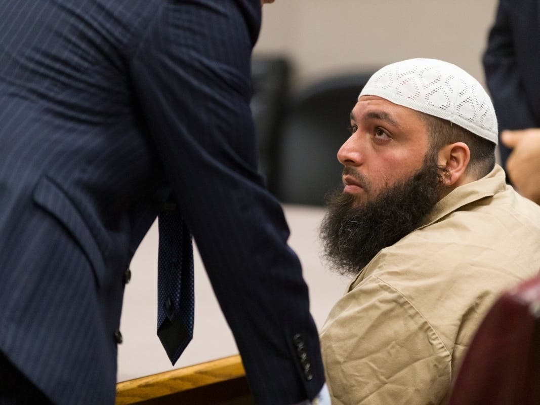 Ahmad Khan Rahimi talks with his attorney during sentencing at the Union County Courthouse on Friday in Elizabeth.
