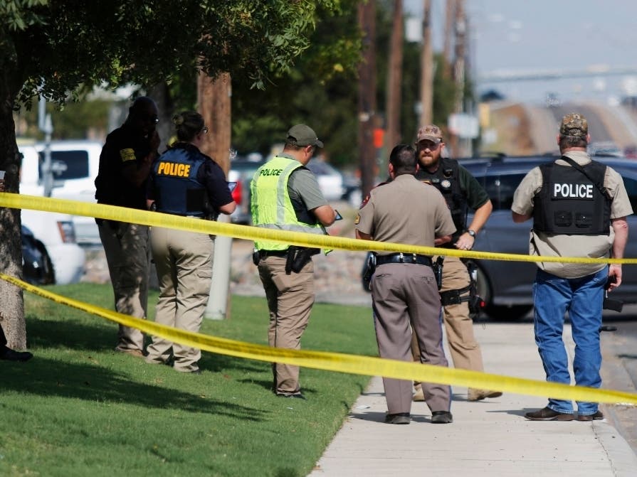 Authorities cordon off a part of the sidewalk in the 5100 block of E. 42nd Street in Odessa, Texas, Saturday, Aug. 31, 2019. 