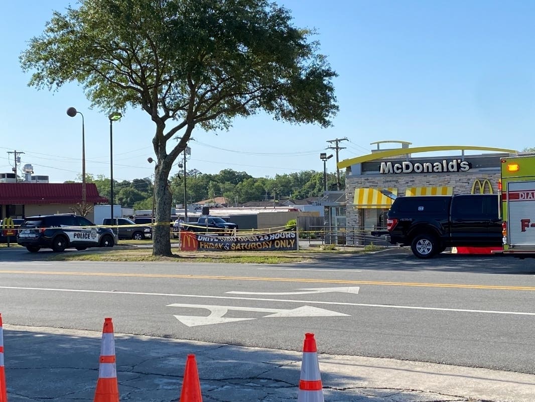 Police vehicles sit parked in front of a McDonald's restaurant as police investigate a shooting in which multiple people were killed Thursday, May 4, 2023, in Moultrie, Ga. 