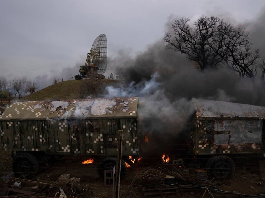 Smoke rise from an air defense base in the aftermath of an apparent Russian strike in Mariupol, Ukraine, Thursday, Feb. 24, 2022.
