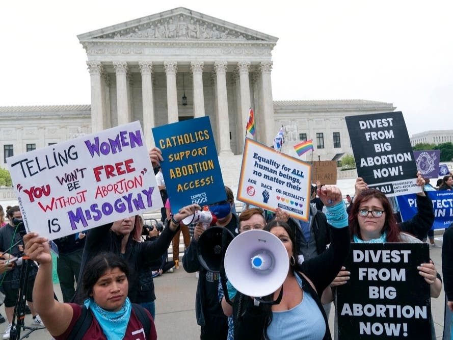 Demonstrators protest outside of the U.S. Supreme Court Tuesday, May 3, 2022 in Washington.