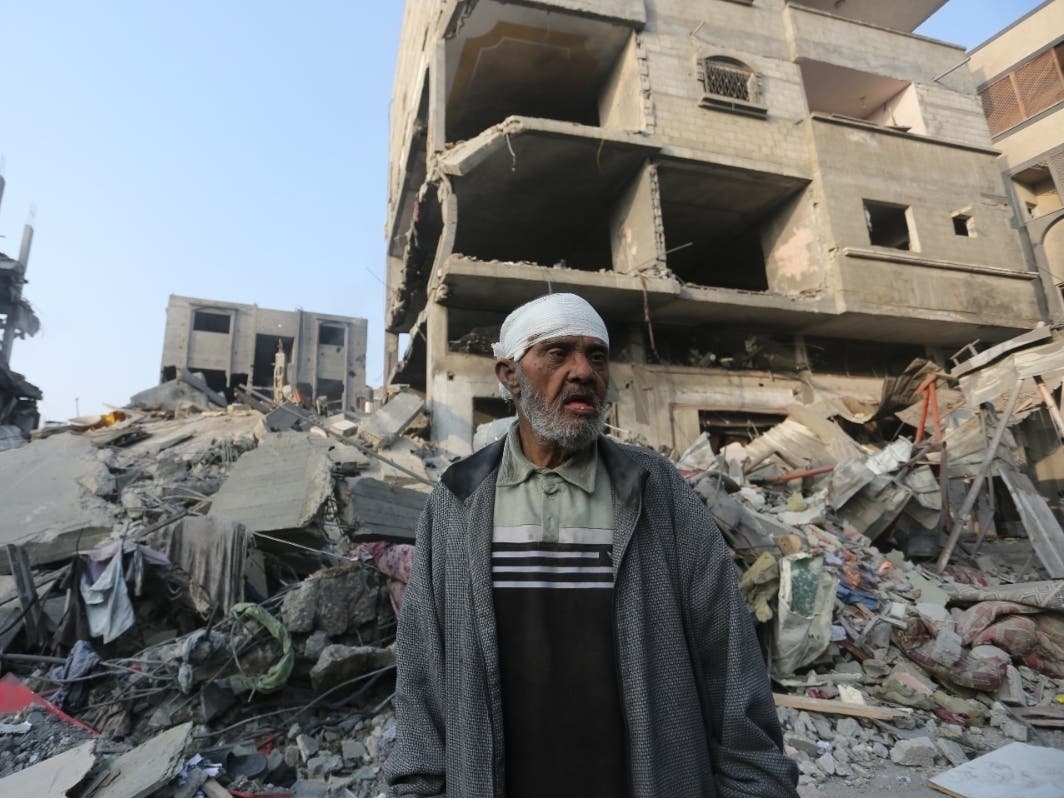 A Palestinian stands outside a building destroyed in the Israeli bombardment of the Gaza Strip in Rafah, Wednesday, Oct 25, 2023.