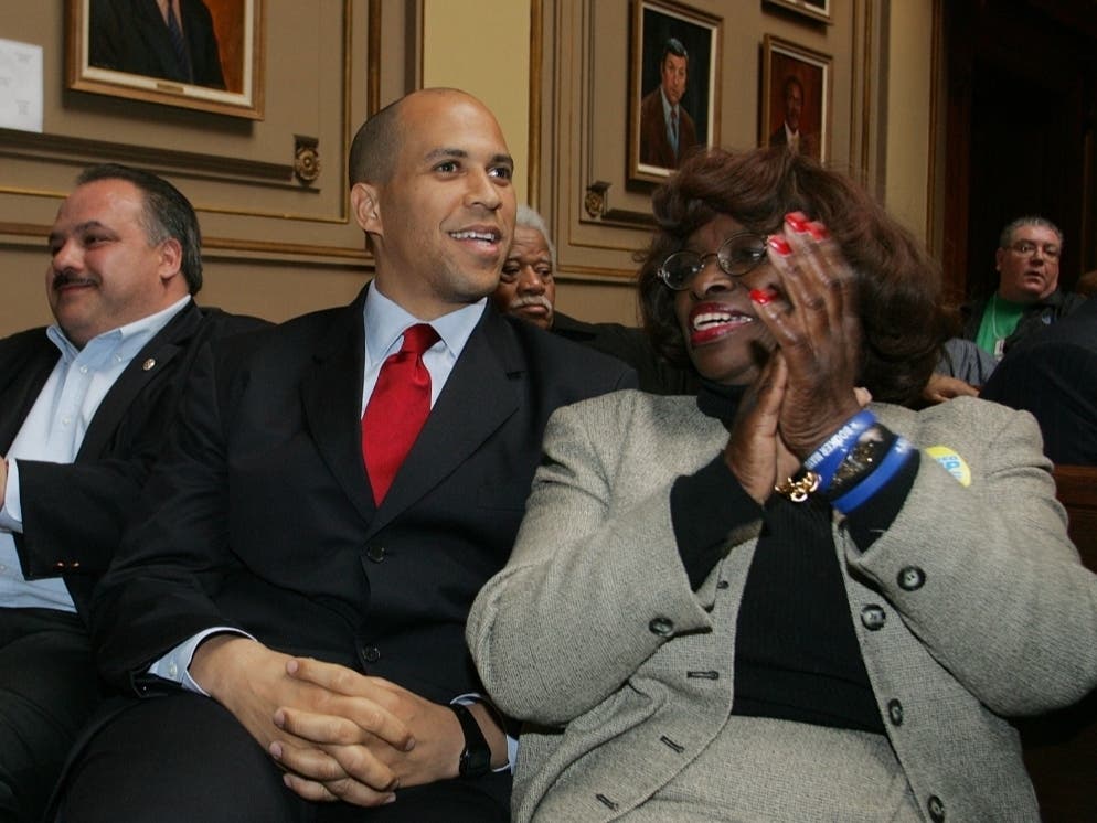 Flags will fly at half-staff in New Jersey this week to honor the life of former Newark City Council president Mildred Crump. Above, Crump (right) attends an event for a mayoral ballot drawing in Newark, N.J. alongside Sen. Cory Booker on March 24, 2006.