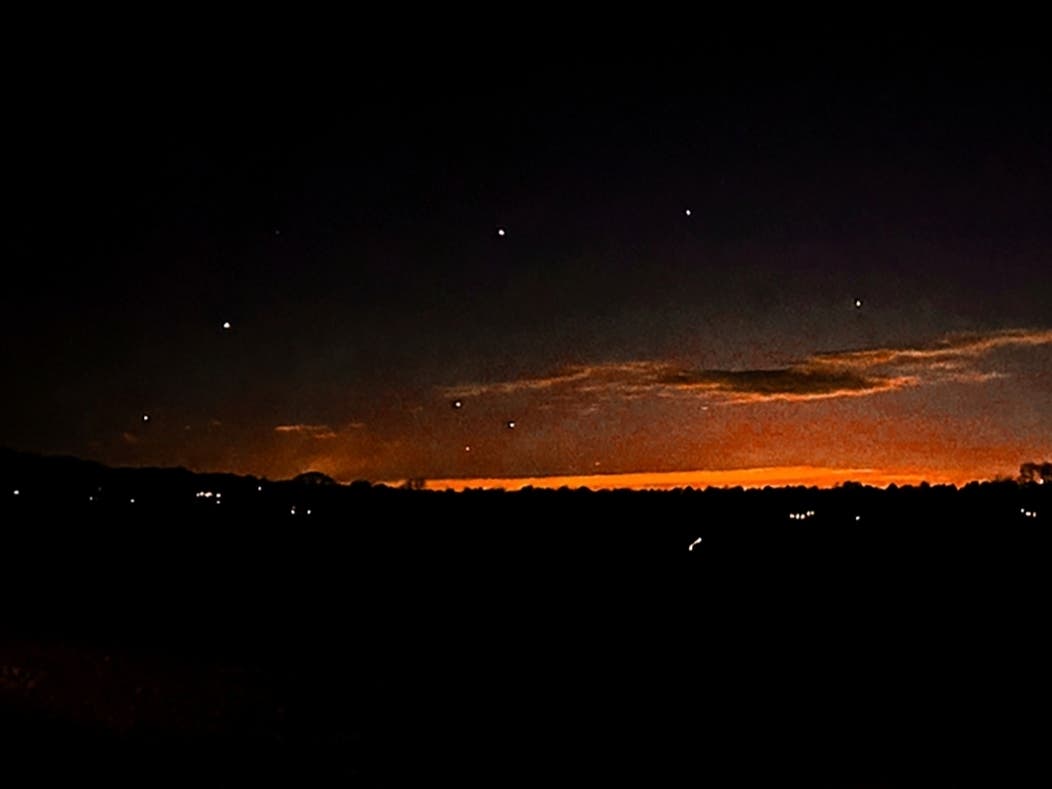 This photo provided by Trisha Bushey shows the evening sky and points of light near in Lebanon Township, N.J., on Thursday, Dec. 5, 2024.