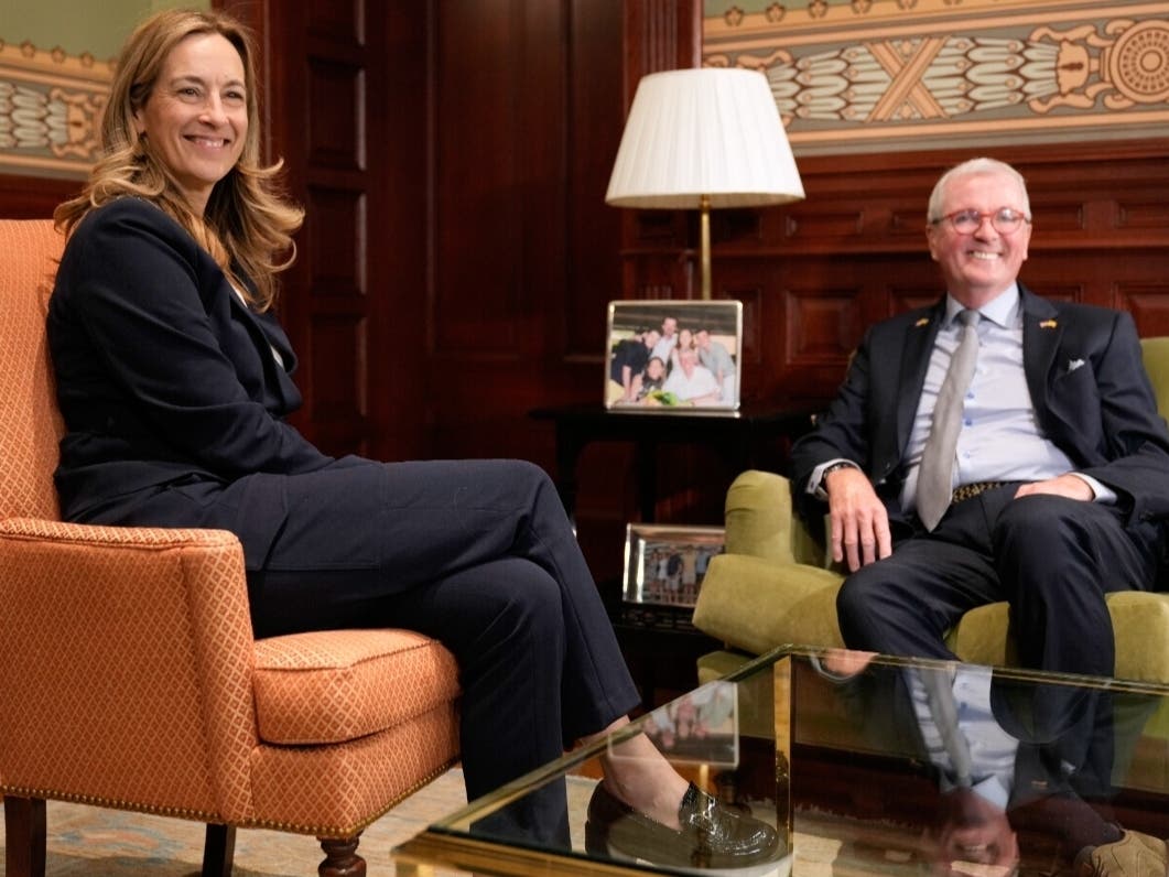 New Jersey Governor Phil Murphy and governor-elect Mikie Sherrill talk during a photo opportunity in the governor's office in Trenton, N.J., Wednesday, Nov. 5, 2025.