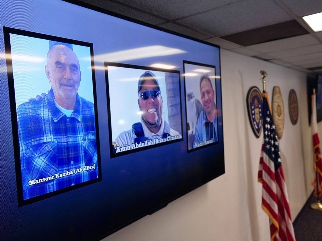 Photos of the three victims at the Islamic Center of San Diego are displayed after a news conference in San Diego, Calif., Tuesday, May 19, 2026.
