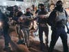 ICE agents go after protestors outside the Delaney Hall detention center during a protest on Wednesday, May 27, 2026, in Newark, N.J.