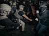 ICE agents use their baton as they clash with protesters outside the Delaney Hall detention center during a protest on Wednesday, May 27, 2026, in Newark, N.J.