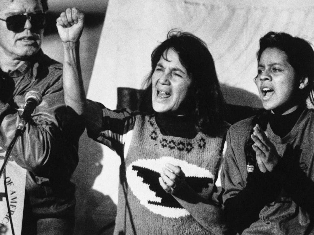 United Farm Workers leader Dolores Huerta, center, leads a rally in San Francisco's Mission District on Nov. 19, 1988.