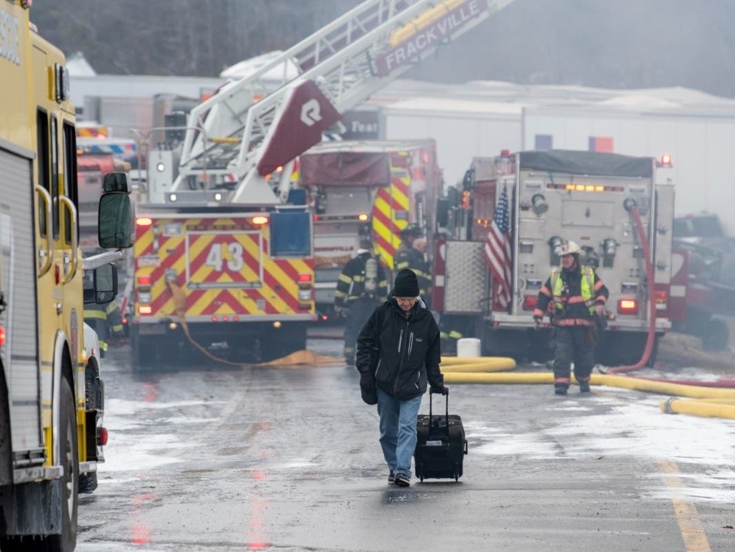 Dane Groszek of Middletown N.Y., makes his way off of Interstate 81 after his car was totaled in a multi-vehicle crash along Interstate 81 North near the Minersville exit, Foster Twp., Pa., on Monday, March 28, 2022. Dan