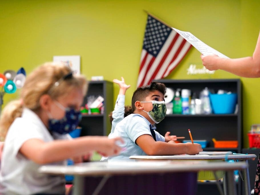 Florida students began the school year on Monday, wearing masks at this prep school in Miami-Dade County.