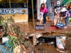 Volunteers, employees and family members remove water and mud from Goldberg's Famous Deli in Millburn, N.J., Saturday, Sept. 4.
