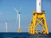 This 2016 photo shows three of the five Deepwater Wind turbines off Block Island, Rhode Island, the nation's first offshore wind farm.