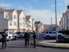 Sayreville police officers stand watch last Thursday.