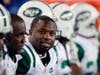 New York Jets linebacker Bart Scott sits on the bench during a game against the New England Patriots on Dec. 6, 2010.