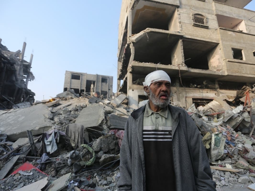 A Palestinian stands outside the building destroyed i the Israeli bombardment of the Gaza Strip in Rafah, Wednesday, Oct 25, 2023.