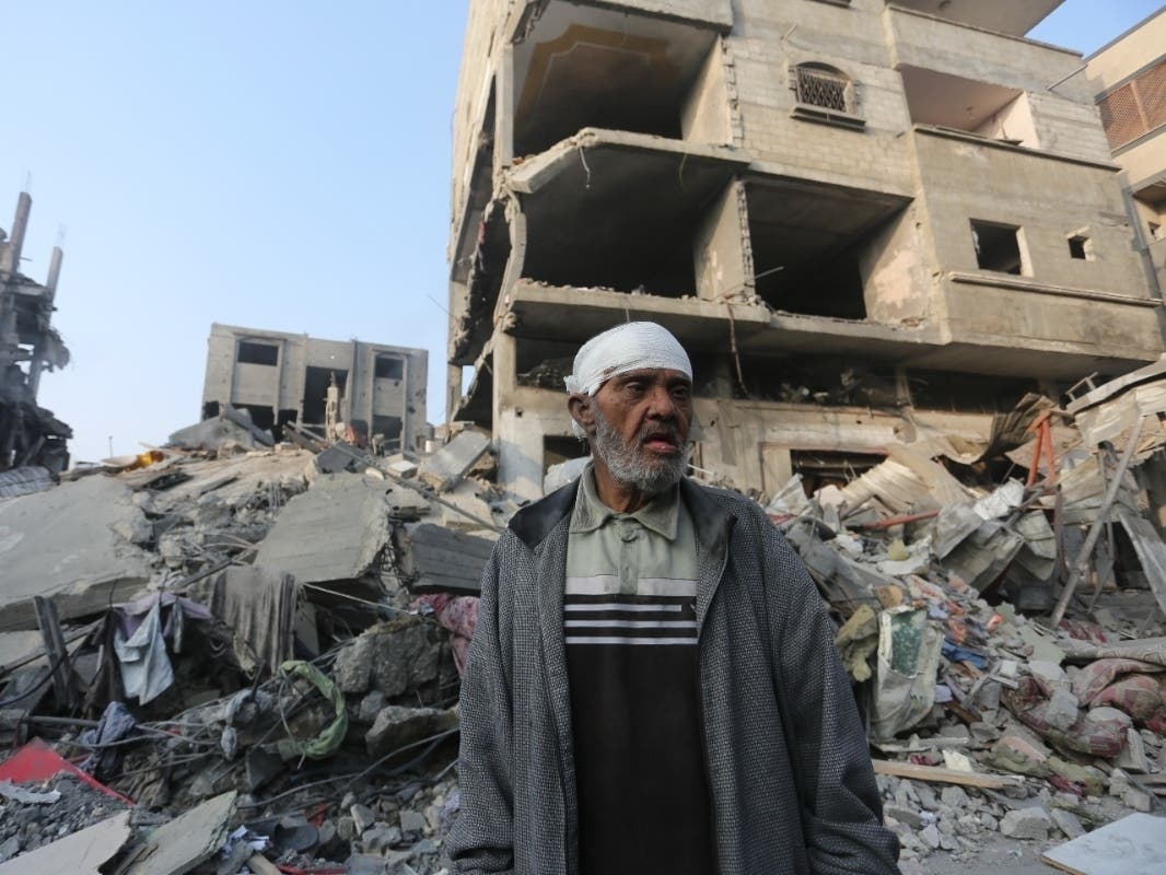A Palestinian stands outside the building destroyed i the Israeli bombardment of the Gaza Strip in Rafah, Wednesday, Oct 25, 2023.