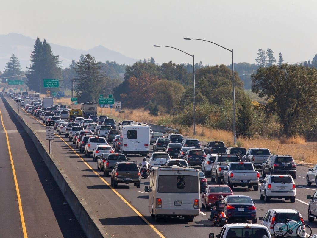Traffic is backed up heading south on US Highway 101 during mandatory evacuations due to predicted danger from the Kincade Fire, in Windsor, Calif., on Saturday, Oct. 26, 2019. The entire communities of Healdsburg and Windsor were ordered to evacuate.