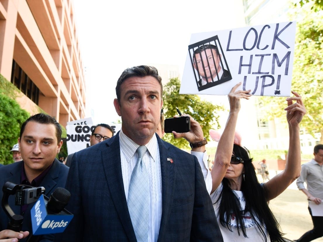 U.S. Rep. Duncan Hunter, R-Calif., leaves federal court after a hearing in San Diego. Hunter, who is facing corruption charges, wants his Sept. 10 trial postponed while his attorneys appeal a judge's refusal a month earlier to dismiss the case. (AP Photo/