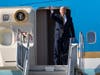 President Donald Trump acknowledges awaiting supporters as he departs Air Force One after arriving at Los Angeles International Airport on Tuesday, Sept. 17, 2019, in Los Angeles.