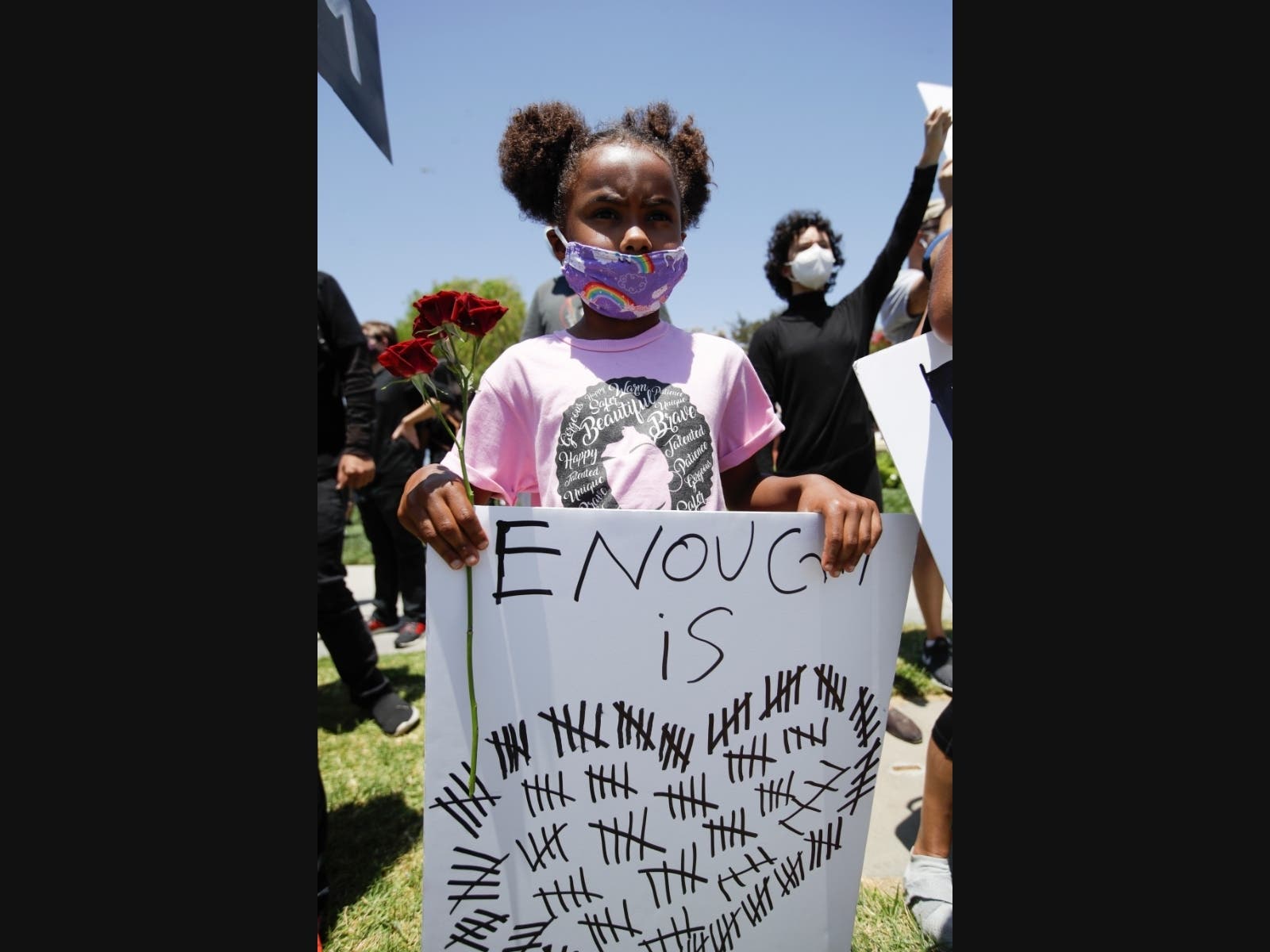 Sabrina Murphy, 6, holds a sign Thursday June, 4, 2020 in Santa Clarita, Calif., during a protest over the death of George Floyd who died May 25 after he was restrained by Minneapolis police.