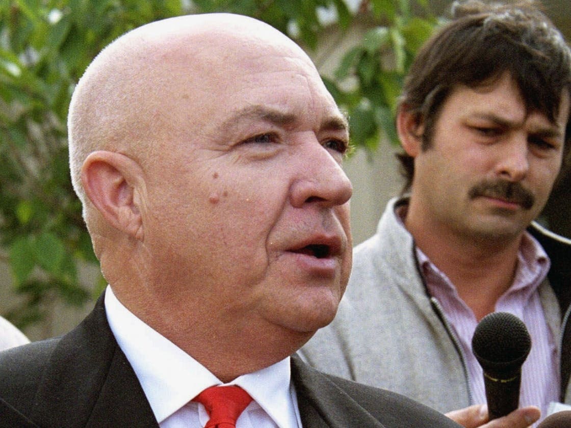 In this Sept. 5, 2000 file photo, Tom Metzger, a former grand wizard of the Ku Klux Klan and founder of the White Aryan Resistance, is seen in Coeur d' Alene, Idaho. 