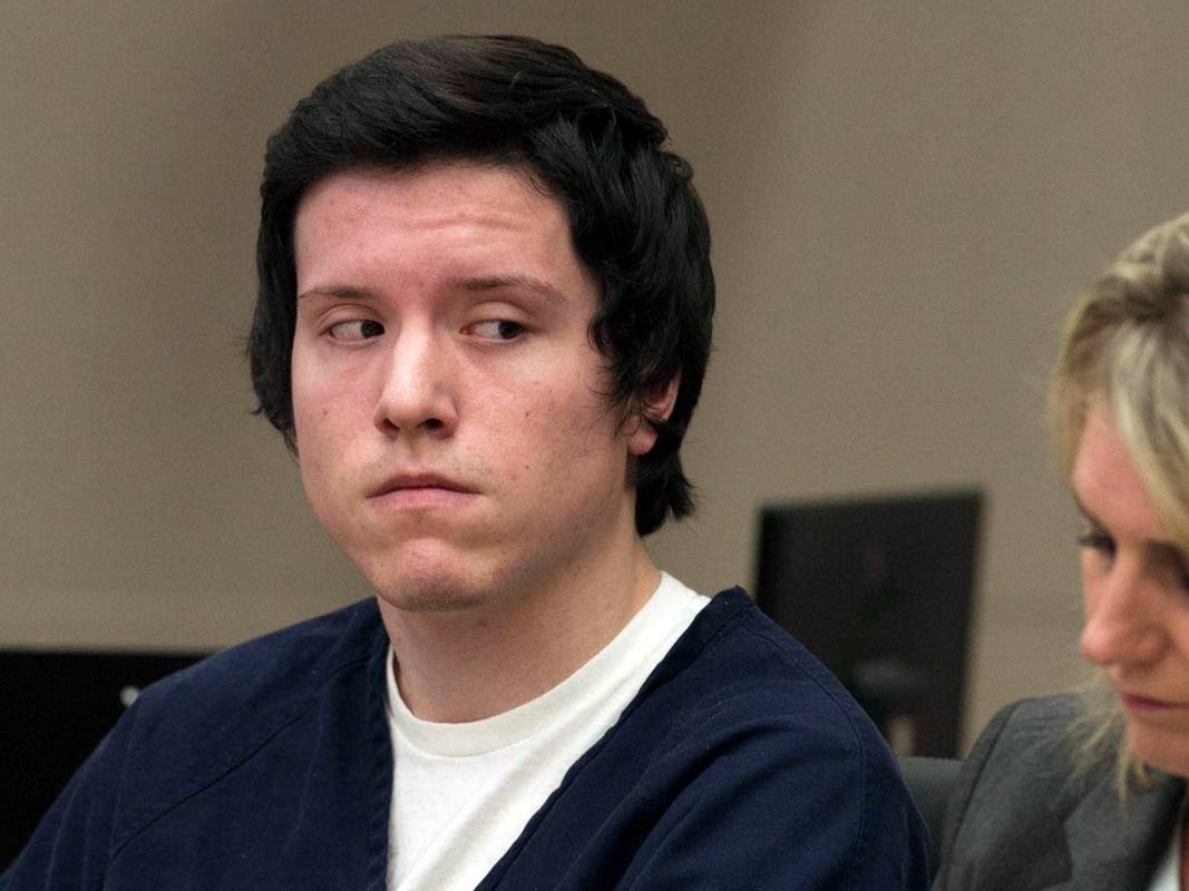 In this Sept. 19, 2019 file photo defendant John Earnest listens during testimony by a witness during a preliminary hearing in Superior Court in San Diego. 