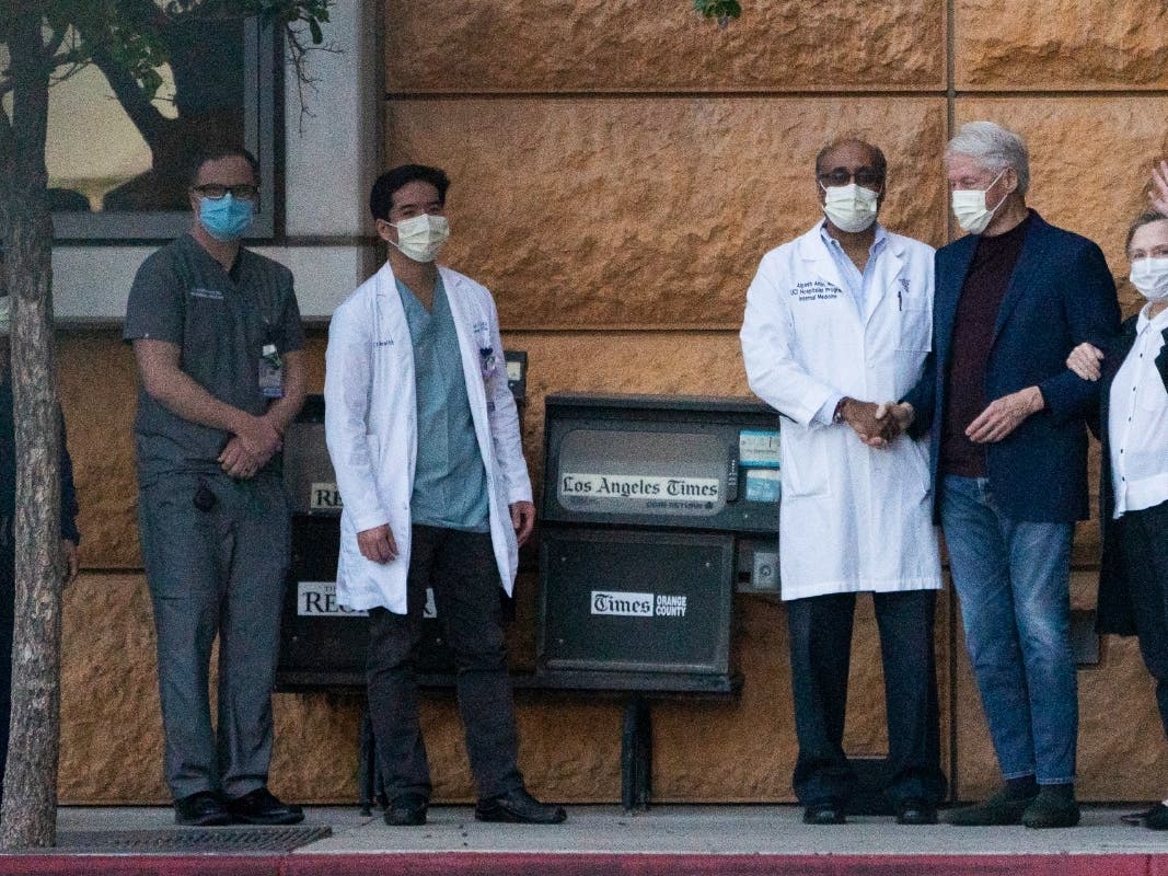 Former President Bill Clinton, and former first lady and former U.S. Secretary of State Hillary Clinton thank Alpesh N. Amin, MD, third from left, and the medical staff as he is released from the University of California Irvine Medical Center in Orange.