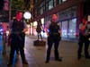 Minneapolis police form a line on the Nicollet Mall at South 7th Street near where a Foot Locker store was looted Wednesday. The Minneapolis mayor imposed a curfew Wednesday night and requested National Guard help.