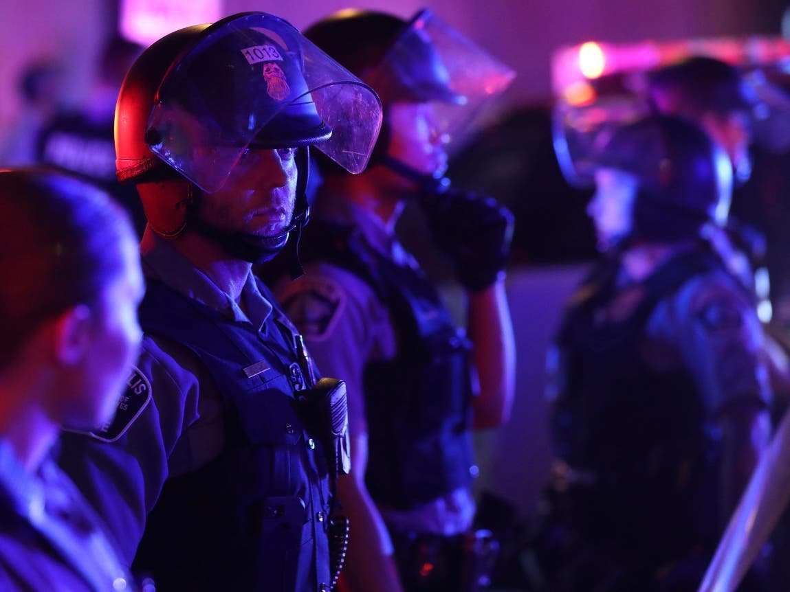 Minneapolis Police form a line on the Nicollet Mall at S. 7th St. near where a Foot Locker store was looted Wednesday, Aug. 26, 2020 in Minneapolis.