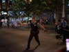 Police spray a substance to clear the area where a colleague was down on the Nicollet Mall Wednesday, Aug. 26, 2020 in Minneapolis. 