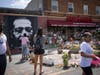 People walk through George Floyd Square after shots were fired on the one year anniversary of George Floyd's death on Tuesday, May 25, 2021, in Minneapolis.
