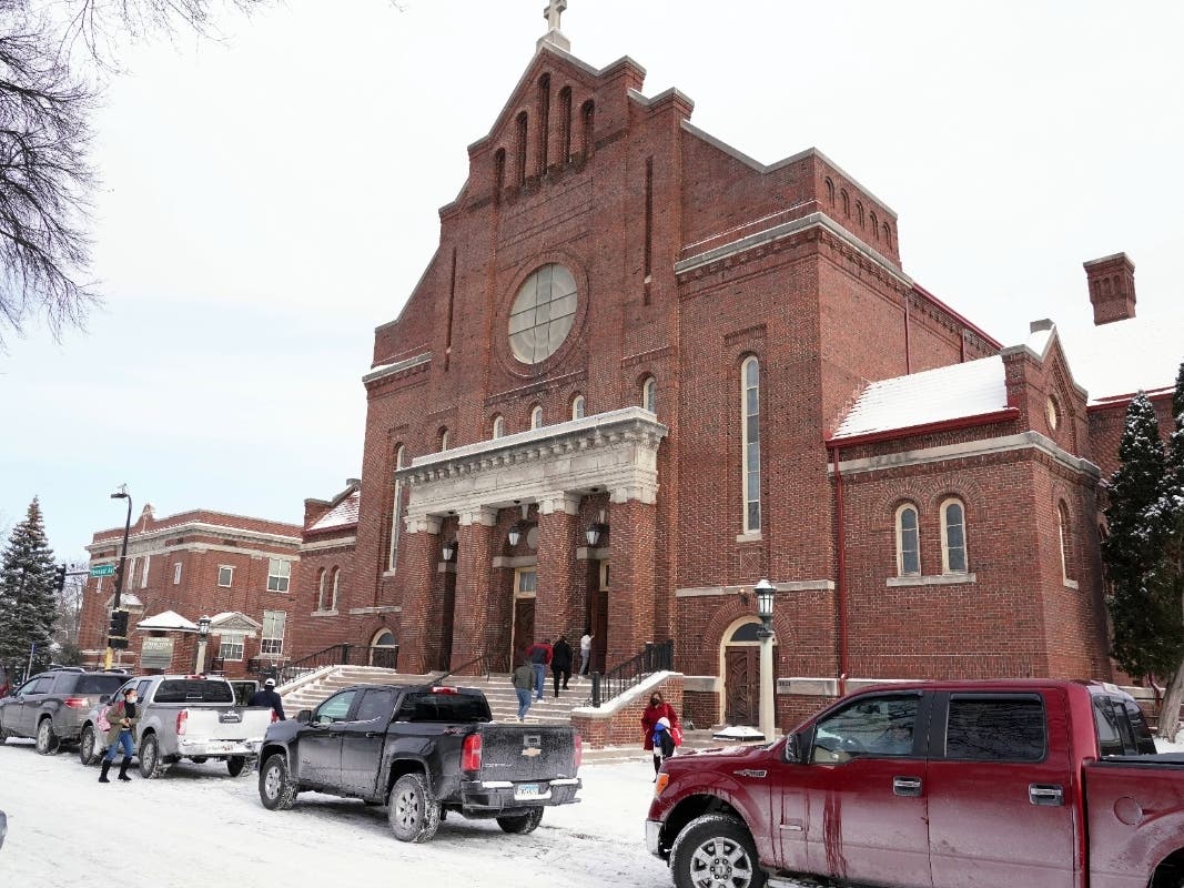 Church of the Incarnation is shown, Sunday, Jan. 23, 2022, in Minneapolis, where residents could pick up coats, sweaters and frozen chicken. 