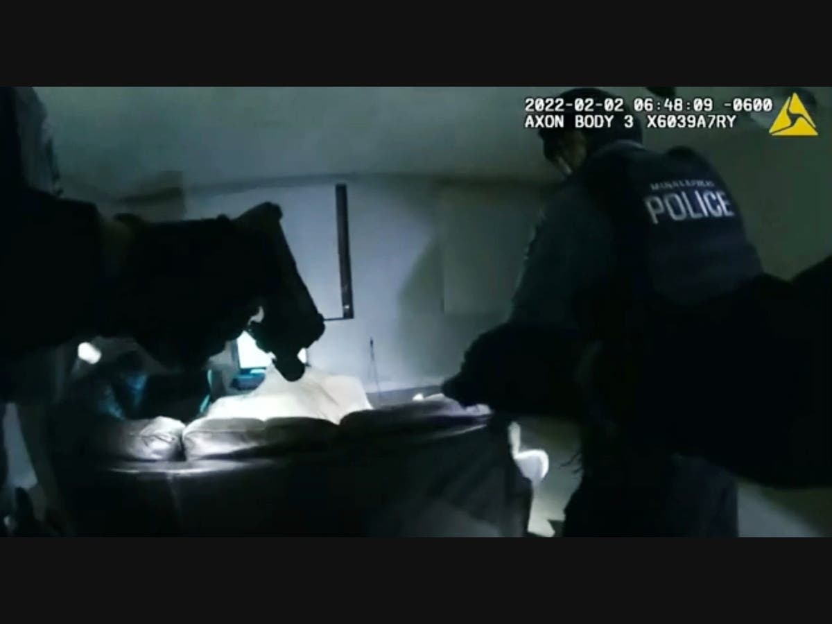 In this image taken from Minneapolis Police Department body camera video and released by the city of Minneapolis, Minneapolis police enter an apartment on Wednesday, Feb. 2, 2022, moments before shooting 22-year-old Amir Locke. 