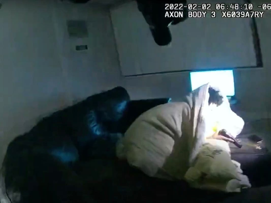 In this image taken from Minneapolis Police Department body camera video and released by the city of Minneapolis, Minneapolis police enter an apartment on Wednesday, Feb. 2, 2022, moments before shooting 22-year-old Amir Locke.