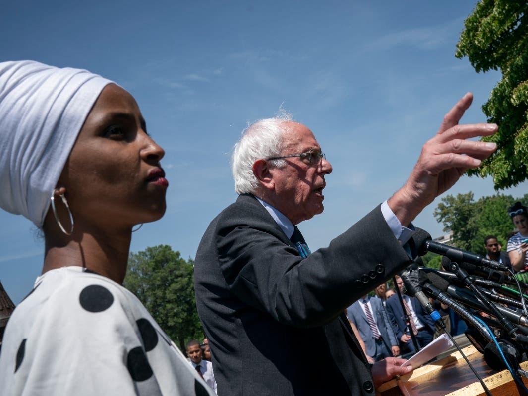Sen. Bernie Sanders, I-Vt., center, joined at left by Rep. Ilhan Omar, D-Minn., announces legislation to cancel all student debt, at the Capitol in Washington, Monday, June 24, 2019.