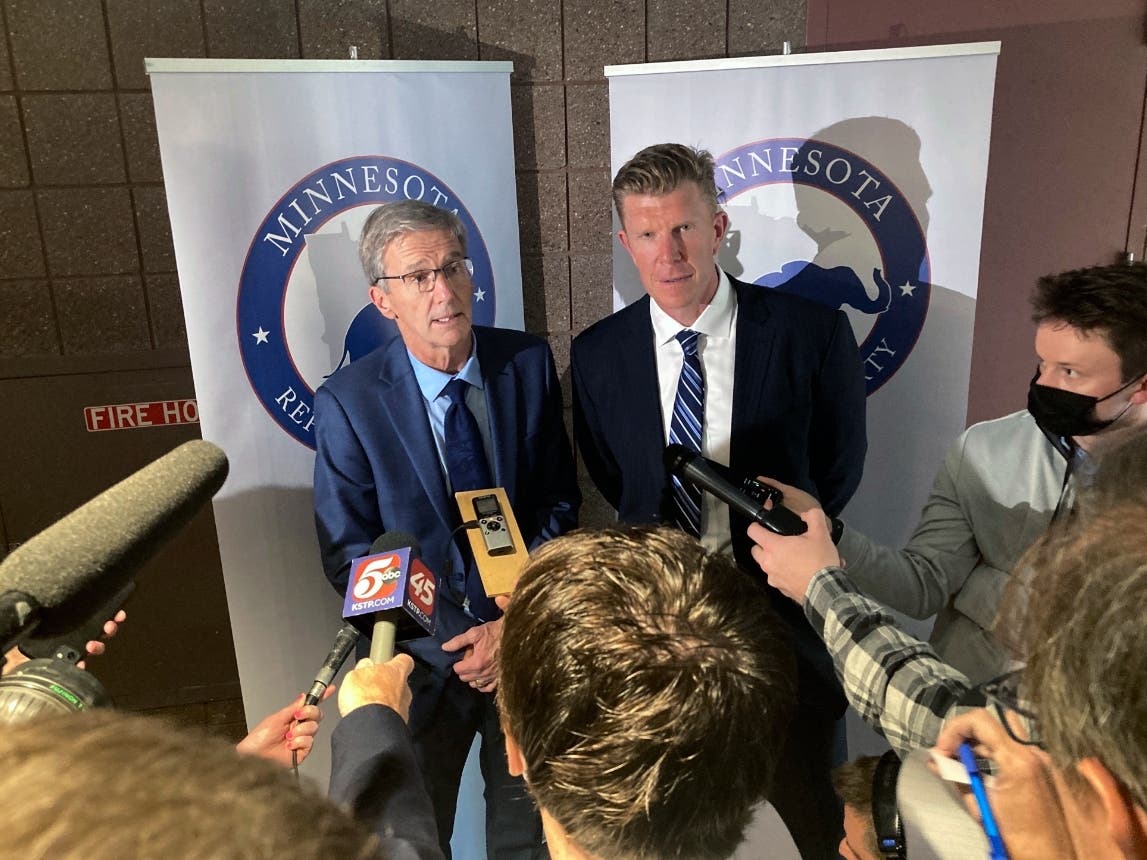 Endorsed Minnesota GOP gubernatorial candidate Dr. Scott Jensen, left, and his running mate, former Minnesota Viking and former Baltimore Raven Matt Birk, speak with reporters after Jensen won the party's backing, Saturday, May 14, 2022.