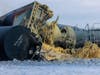 Train cars pile up near Raymond, Minn. after a BNSF freight train derailed, Thursday, March 30, 2023.