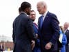 President Joe Biden shakes hands with Saint Paul Mayor Melvin Carter as he arrives at Minneapolis−Saint Paul International Airport, Monday, April 3, 2023, in Minneapolis.