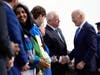 President Joe Biden shakes hands with Minnesota Gov. Tim Walz as he arrives at Minneapolis−Saint Paul International Airport, Monday, April 3, 2023, in Minneapolis. 