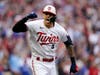 Minnesota Twins' Carlos Correa reacts after hitting an RBI single during the fourth inning of Game 2 of an AL wild-card baseball playoff series against the Toronto Blue Jays Wednesday, Oct. 4, 2023, in Minneapolis.