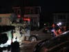 Protesters shout at law enforcement officers after a shooting on Wednesday, Jan. 14, 2026, in Minneapolis.