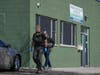 FBI agents walk outside the Mako Child Care Center in Minneapolis, Minn. on Tuesday, April 28, 2026.