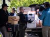 Federal and state officials load evidence into a vehicle as they execute a search warrant at The Original Childcare Center in south Minneapolis, Tuesday, April 28, 2026.