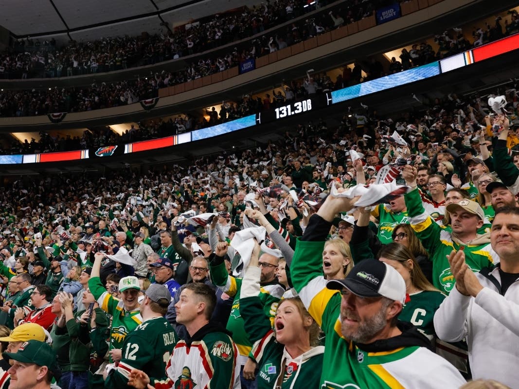 Minnesota Wild fans cheer during the third period of Game 6 in the first round of the NHL hockey Stanley Cup playoff series against the Dallas Stars, Thursday, April 30, 2026, in St. Paul, Minn.