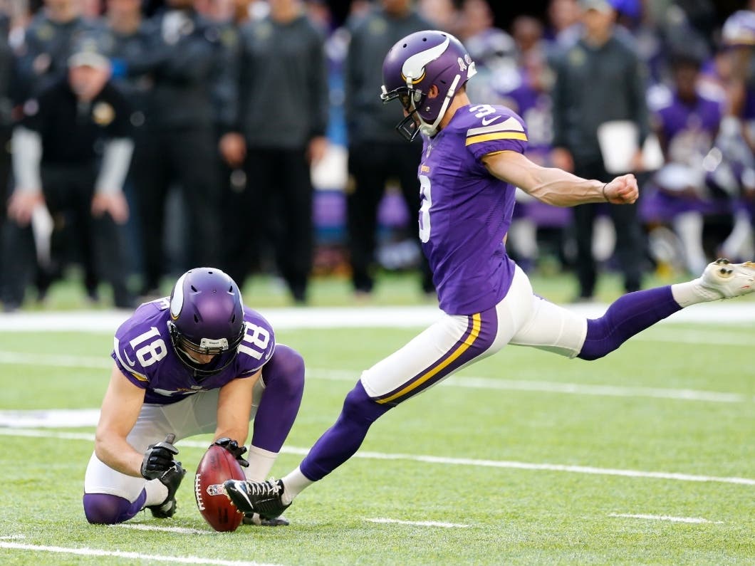 Minnesota Vikings kicker Blair Walsh, right, attempts a field goal during the second half of an NFL football game against the Detroit Lions Sunday, Nov. 6, 2016, in Minneapolis.